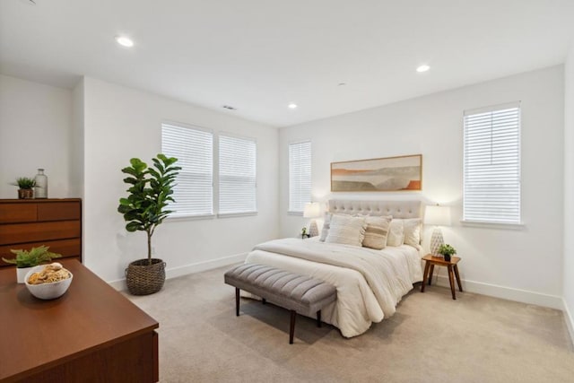 bedroom with light carpet