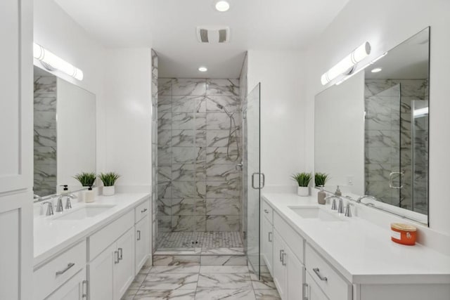 bathroom with walk in shower and vanity