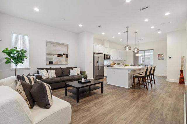 living room with light hardwood / wood-style floors