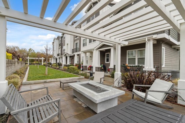 view of patio with a pergola and an outdoor fire pit