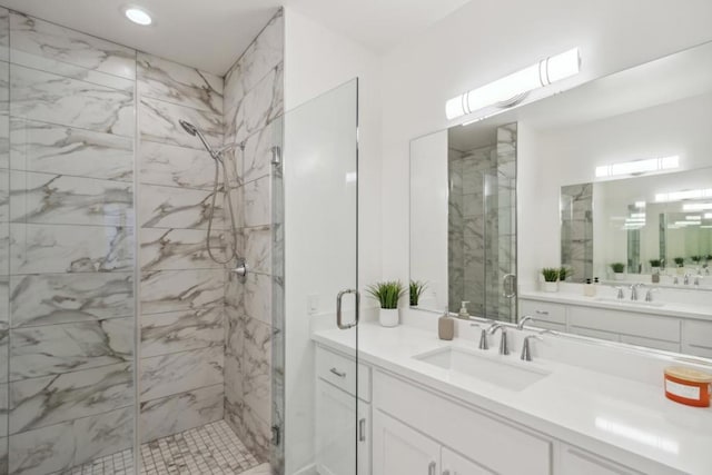 bathroom with vanity and an enclosed shower