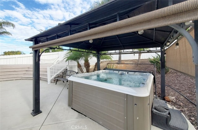 view of patio with a gazebo and a hot tub