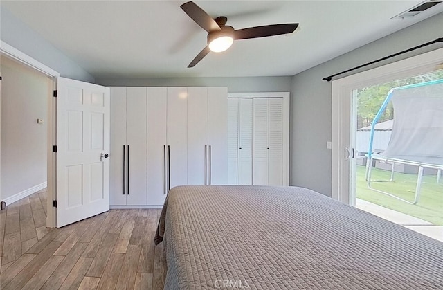 unfurnished bedroom with ceiling fan, access to exterior, and light hardwood / wood-style flooring