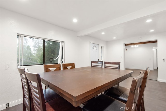 dining space with baseboards, wood finished floors, and recessed lighting