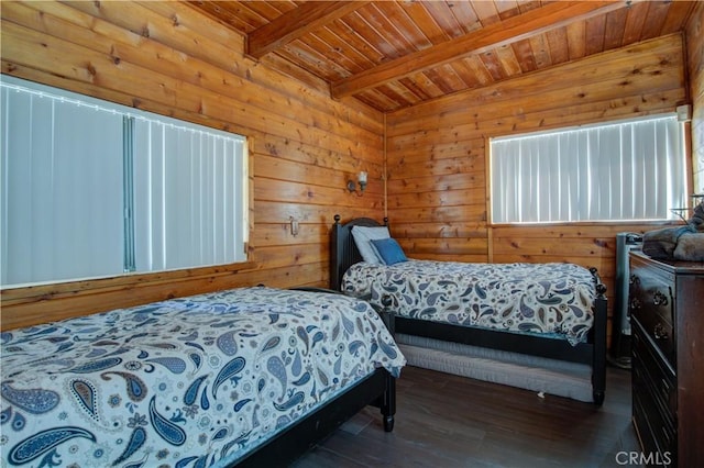 bedroom with beamed ceiling, wood finished floors, wood walls, and wood ceiling