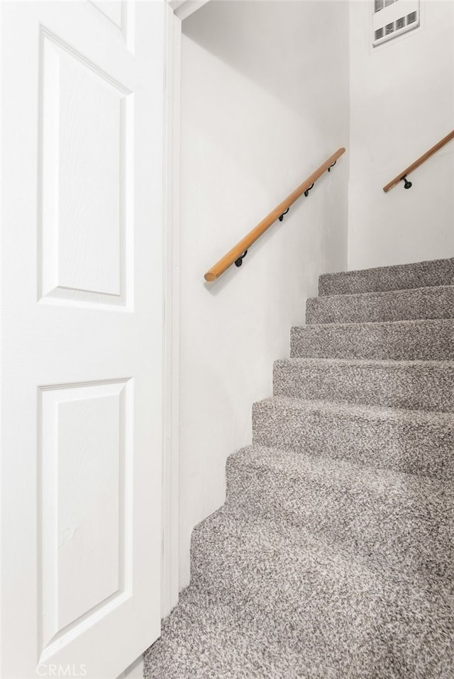 staircase with visible vents