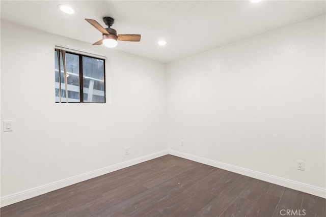 spare room featuring a ceiling fan, baseboards, recessed lighting, and dark wood-type flooring