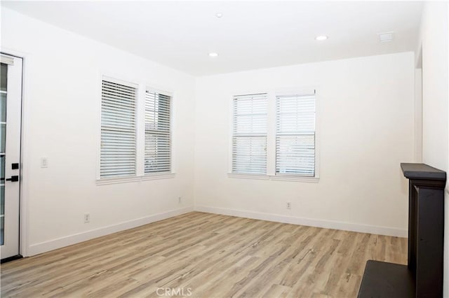 unfurnished living room with light wood-type flooring