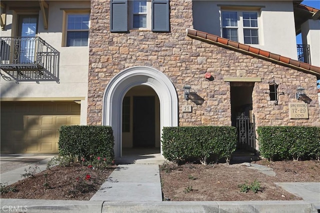 doorway to property featuring a garage