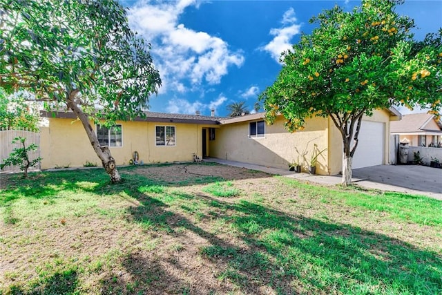 exterior space with a yard and a garage