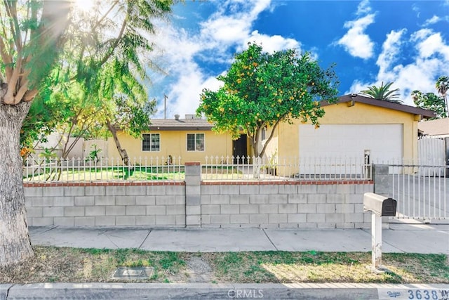 single story home featuring a garage