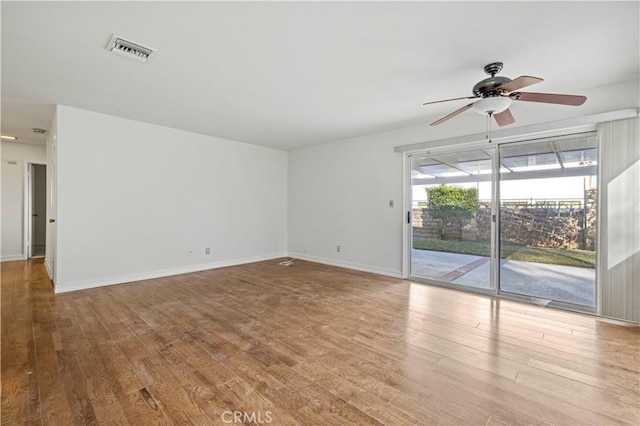 spare room featuring ceiling fan and wood-type flooring