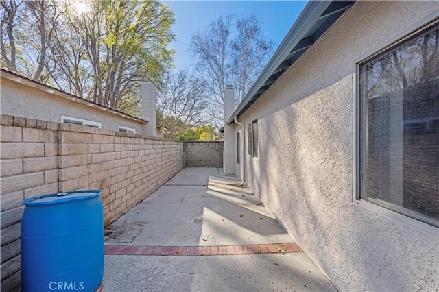 view of side of property featuring a patio