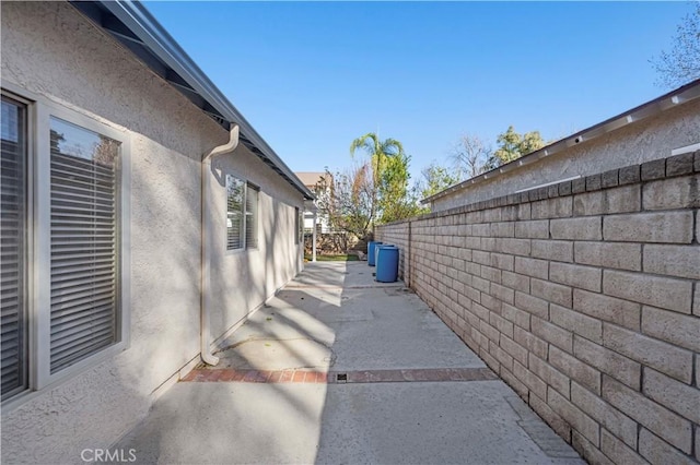 view of side of property with a patio