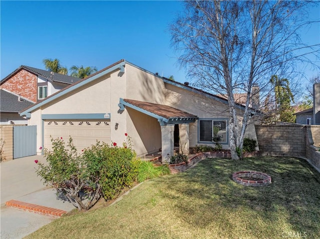 view of front of property with a front yard and a garage