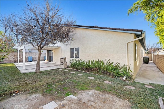 view of side of property with a patio