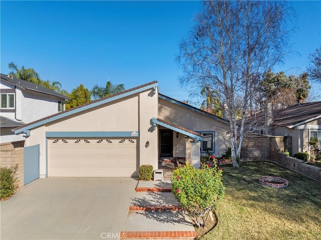 ranch-style home featuring a front yard and a garage