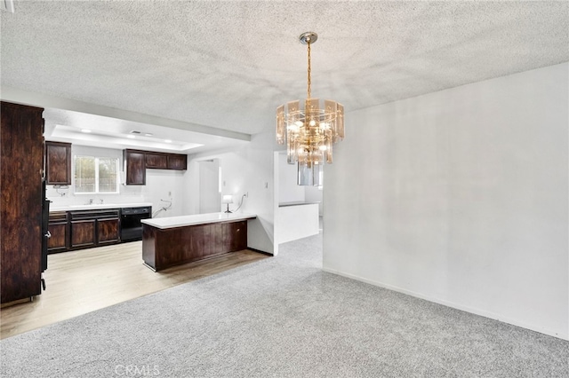 kitchen with light carpet, a notable chandelier, dark brown cabinets, hanging light fixtures, and sink