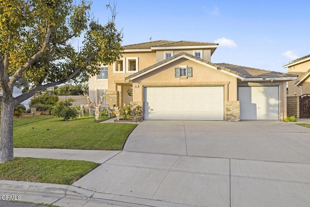 view of front of house with a front yard and a garage