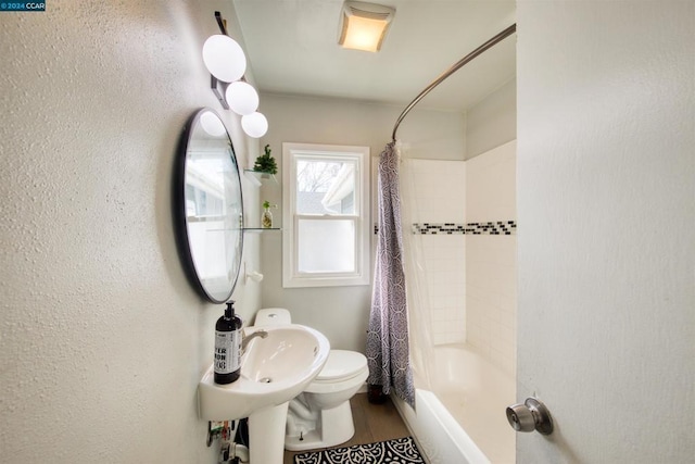 full bathroom featuring toilet, shower / tub combo, sink, and hardwood / wood-style flooring