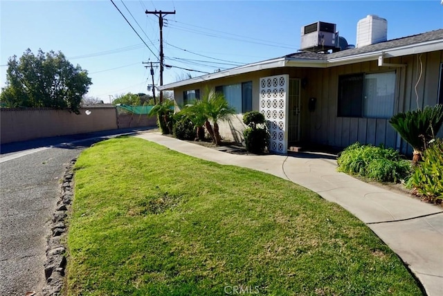 view of yard with central AC