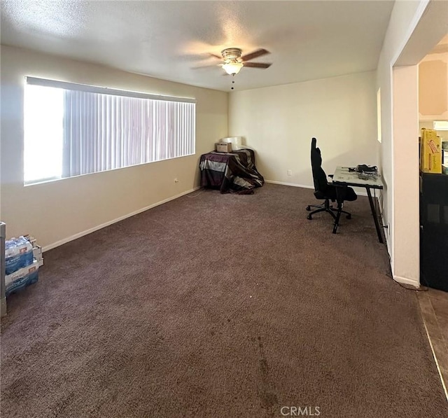 unfurnished office featuring dark carpet