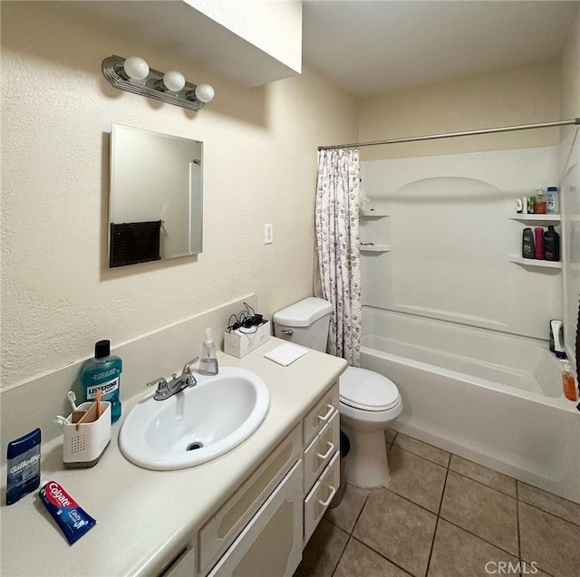 full bathroom featuring vanity, toilet, tile patterned flooring, and shower / bath combo with shower curtain