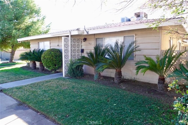 ranch-style house with a front yard