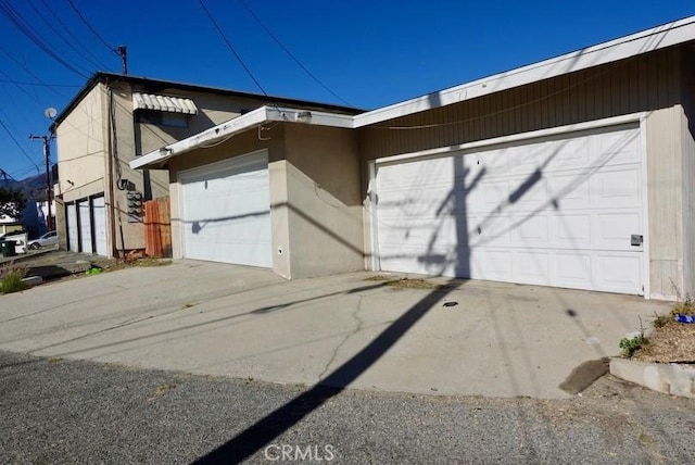 view of side of home with a garage