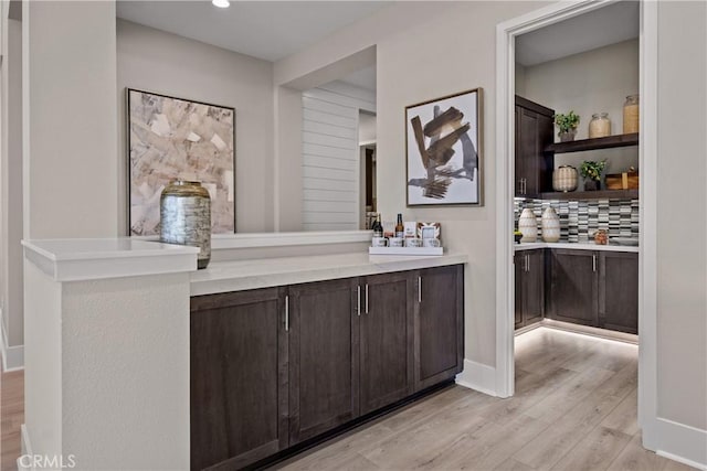 bathroom featuring tasteful backsplash, vanity, and hardwood / wood-style flooring