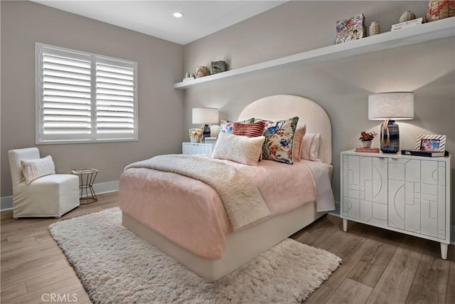 bedroom with wood-type flooring