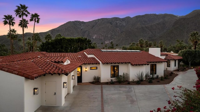 view of front of property with a mountain view