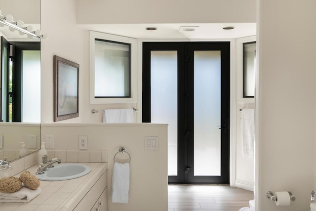 bathroom featuring wood-type flooring and vanity