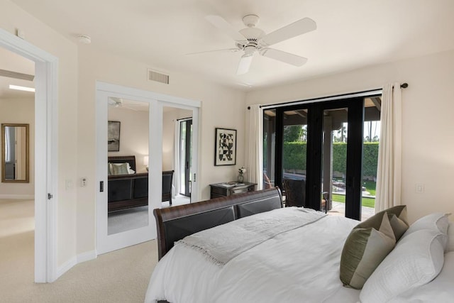 bedroom featuring ceiling fan, light colored carpet, access to outside, and french doors