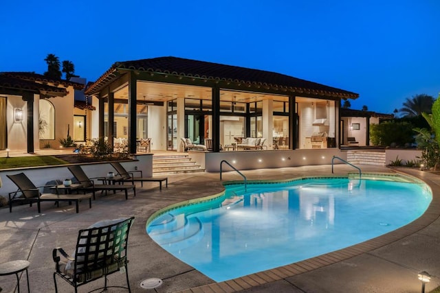 view of swimming pool featuring a patio area