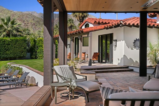 view of patio / terrace featuring a mountain view