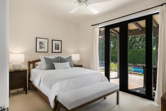 carpeted bedroom with ceiling fan, multiple windows, and access to outside