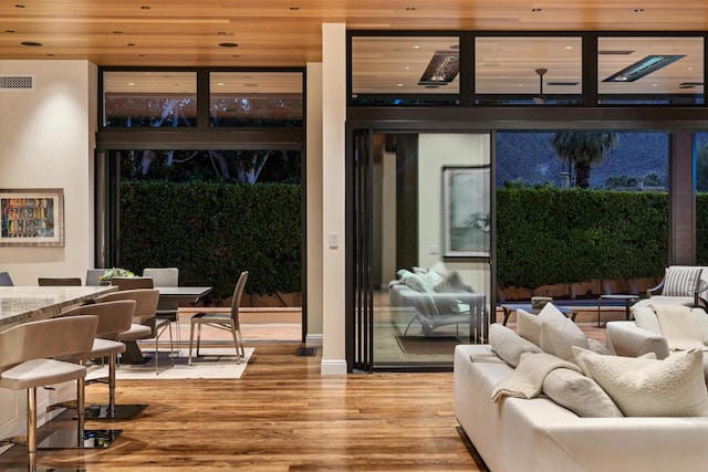 doorway featuring wood-type flooring and wood ceiling