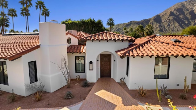 mediterranean / spanish-style house featuring a mountain view