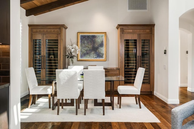 dining room with dark hardwood / wood-style flooring, wood ceiling, wine cooler, and lofted ceiling with beams