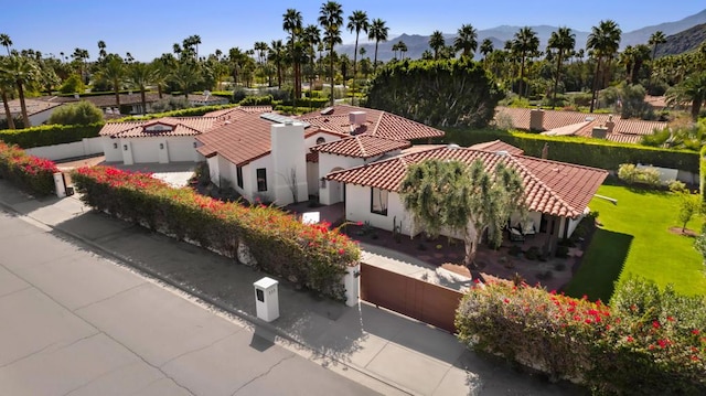 birds eye view of property with a mountain view