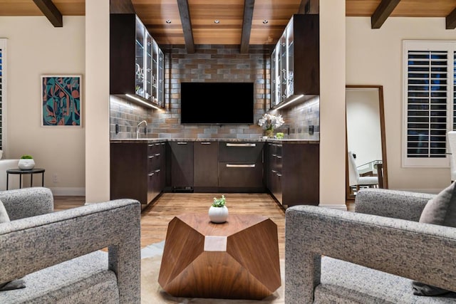 living room with beamed ceiling, light hardwood / wood-style floors, and wooden ceiling