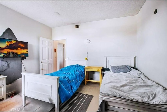 bedroom featuring a textured ceiling