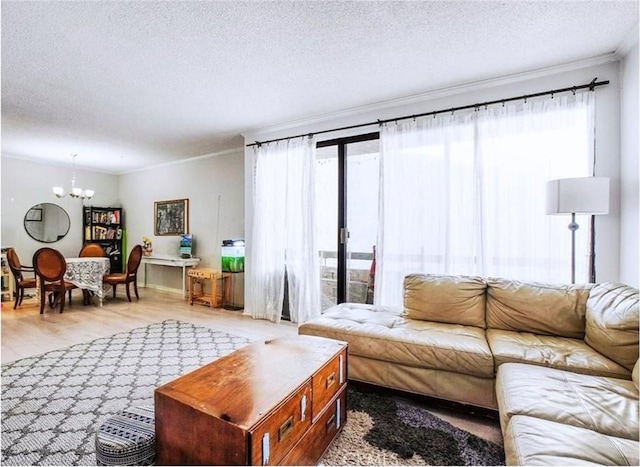 living room with an inviting chandelier, hardwood / wood-style floors, and a textured ceiling