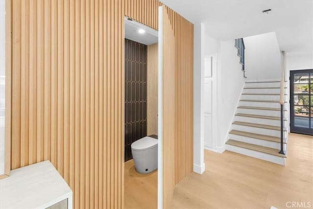 bathroom with toilet and wood-type flooring