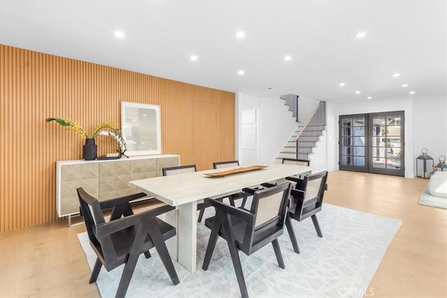 dining room with wood walls