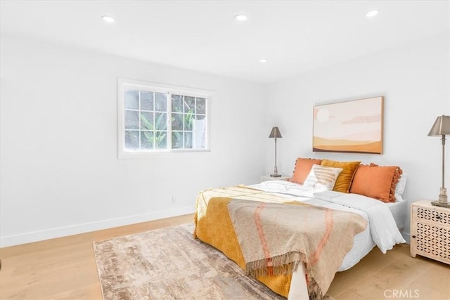 bedroom with light wood-type flooring