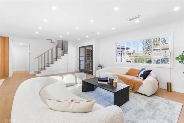 living room with light hardwood / wood-style flooring