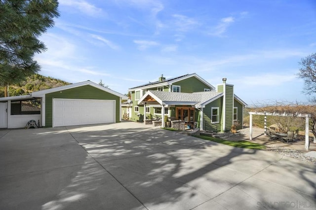 view of front of home with covered porch and a garage