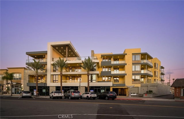 view of outdoor building at dusk